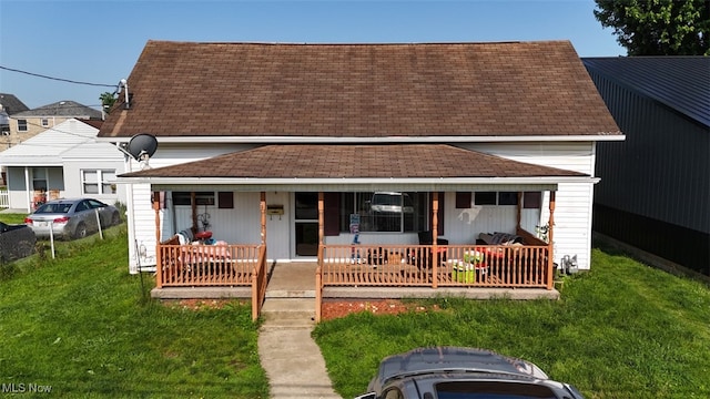 805 Warren Ave, Belpre, OH 45714 - view of front of property featuring covered porch, a front lawn, and a shingled roof