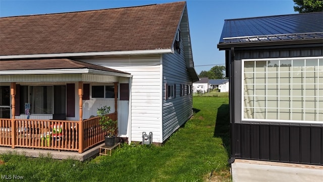 805 Warren Ave, Belpre, OH 45714 - view of side of property featuring a porch and a lawn
