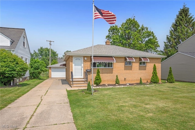 233 E 305th St, Willowick, OH 44095 - view of front facade featuring brick siding, entry steps, a front lawn, an outdoor structure, and a detached garage