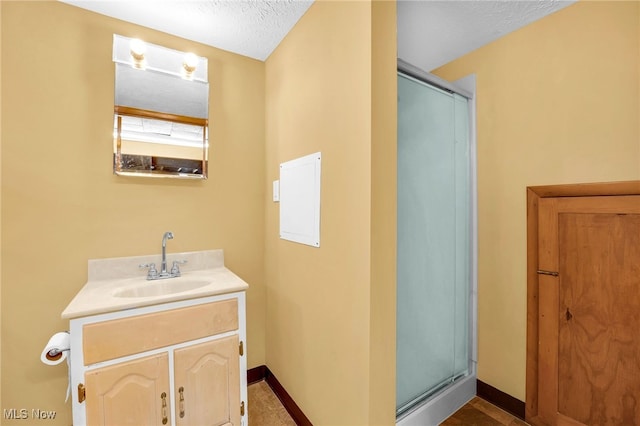 233 E 305th St, Willowick, OH 44095 - bathroom featuring vanity, a stall shower, and a textured ceiling