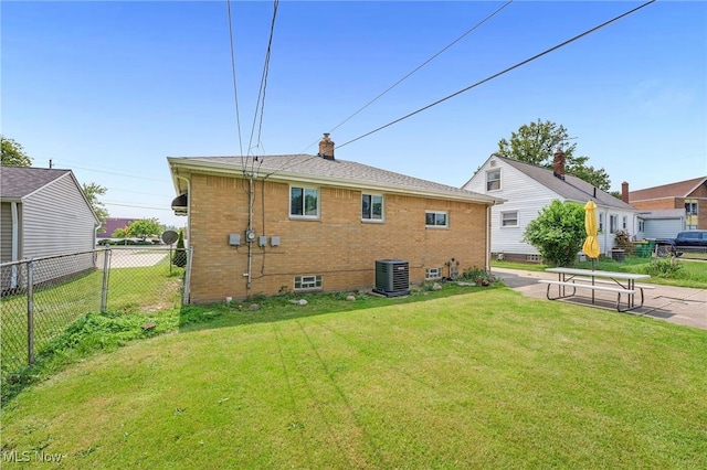 233 E 305th St, Willowick, OH 44095 - rear view of property featuring a chimney and brick siding