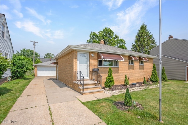 233 E 305th St, Willowick, OH 44095 - view of front of house featuring brick siding, an outbuilding, a garage, a chimney, and a front lawn