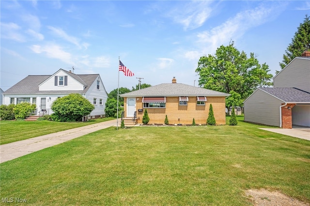 233 E 305th St, Willowick, OH 44095 - view of front of property featuring brick siding, a front lawn, a chimney, and entry steps