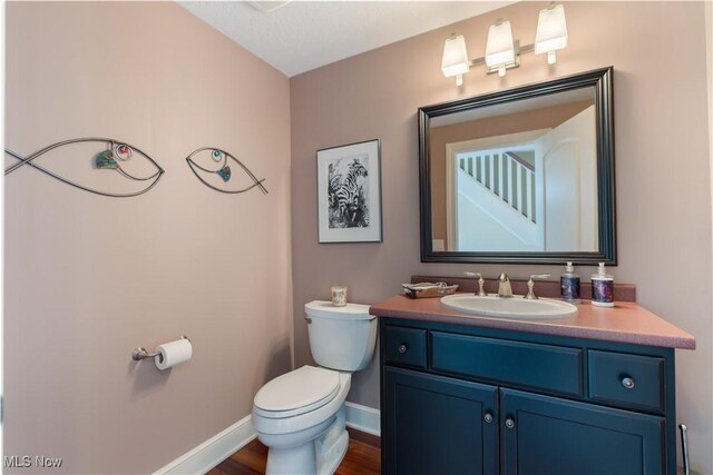 30 E Mohawk Dr, Malvern, OH 44644 - bathroom featuring vanity and wood finished floors