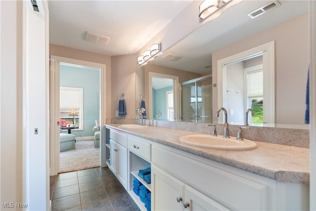 30 E Mohawk Dr, Malvern, OH 44644 - bathroom featuring double vanity, a shower stall, and tile patterned flooring