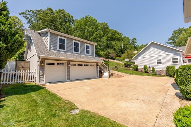 30 E Mohawk Dr, Malvern, OH 44644 - view of front of property featuring roof with shingles, driveway, an attached garage, and stairs