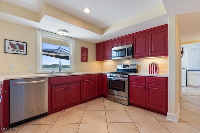 30 E Mohawk Dr, Malvern, OH 44644 - kitchen with stainless steel appliances, light countertops, light tile patterned floors, dark brown cabinets, and recessed lighting