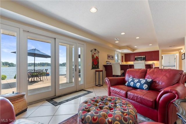 30 E Mohawk Dr, Malvern, OH 44644 - living area with light tile patterned flooring, recessed lighting, and a water view