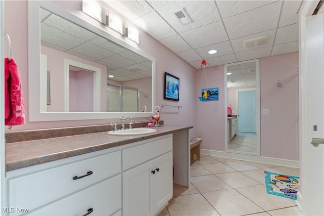 30 E Mohawk Dr, Malvern, OH 44644 - bathroom featuring vanity, tile patterned flooring, an enclosed shower, and a drop ceiling