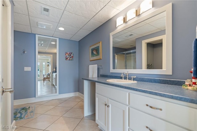 30 E Mohawk Dr, Malvern, OH 44644 - bathroom featuring a drop ceiling, vanity, tile patterned floors, and a shower with door