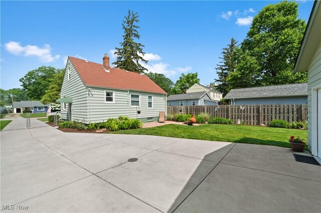 3937 W 227th St, Fairview Park, OH 44126 - back of house with a patio and a chimney
