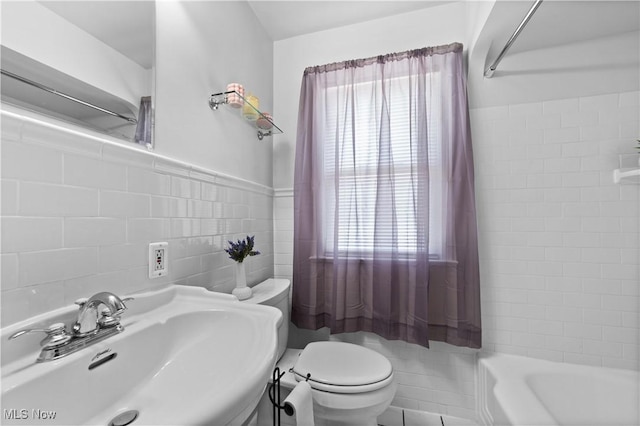 3937 W 227th St, Fairview Park, OH 44126 - bathroom featuring tile walls, healthy amount of natural light, and  shower combination