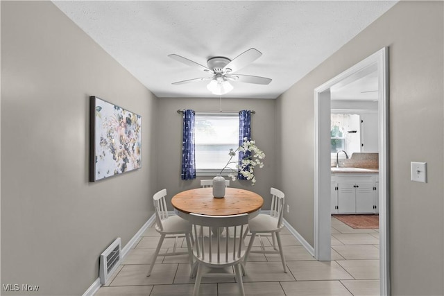 3937 W 227th St, Fairview Park, OH 44126 - dining space with ceiling fan and light tile patterned floors