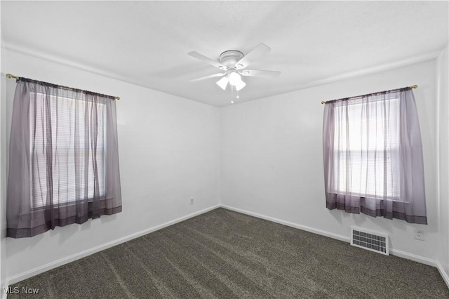 3937 W 227th St, Fairview Park, OH 44126 - spare room featuring ceiling fan and dark colored carpet