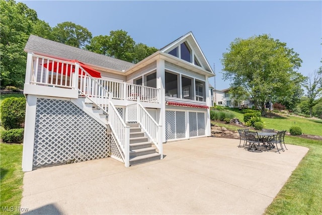 32 E Mohawk Dr, Malvern, OH 44644 - rear view of house with a patio area, a sunroom, a shingled roof, a yard, and stairs