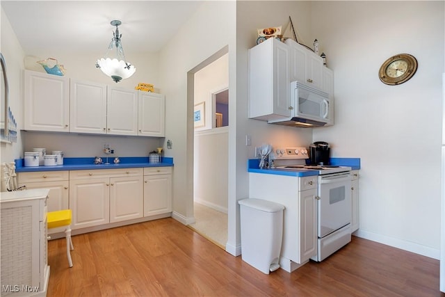 32 E Mohawk Dr, Malvern, OH 44644 - kitchen featuring white appliances, light wood-type flooring, white cabinets, and decorative light fixtures