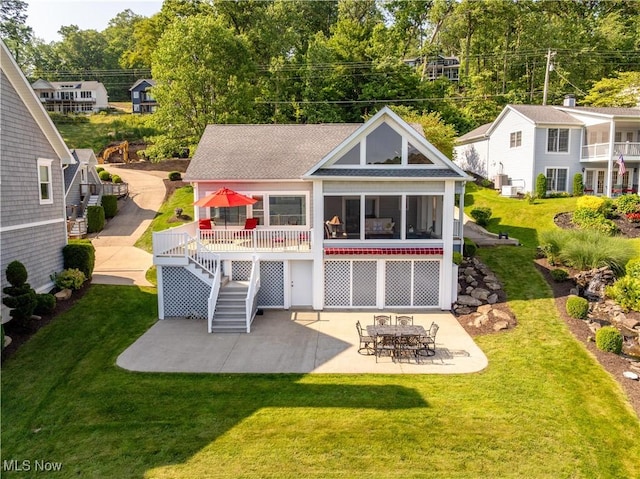 32 E Mohawk Dr, Malvern, OH 44644 - back of house featuring a patio area, stairway, a lawn, and roof with shingles