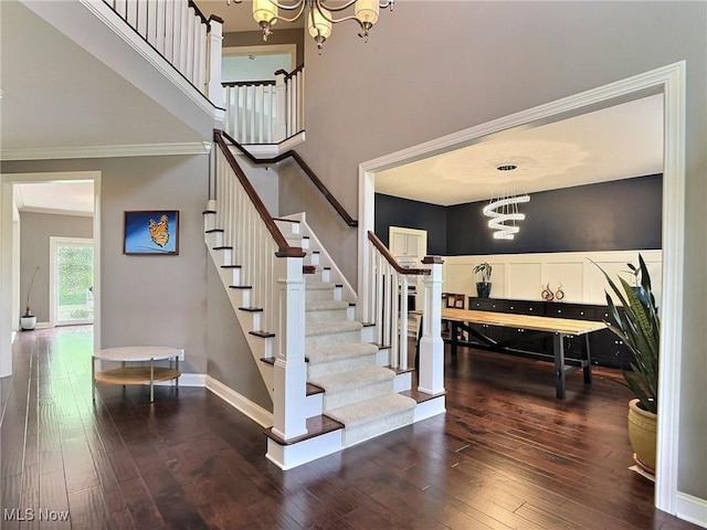 3179 Merion Ct, Westlake, OH 44145 - staircase with a chandelier, hardwood / wood-style flooring, and crown molding