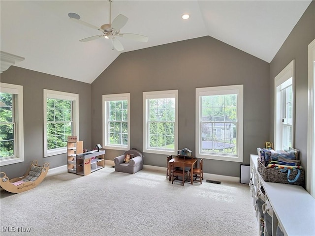 3179 Merion Ct, Westlake, OH 44145 - living area featuring light carpet, vaulted ceiling, plenty of natural light, and a ceiling fan