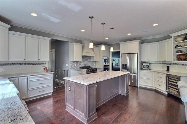 3179 Merion Ct, Westlake, OH 44145 - kitchen featuring stainless steel appliances, beverage cooler, crown molding, tasteful backsplash, and a center island