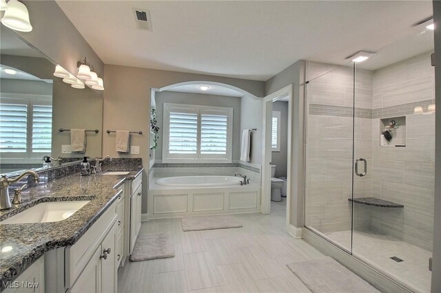 3179 Merion Ct, Westlake, OH 44145 - bathroom with a bath, a shower stall, healthy amount of natural light, and double vanity