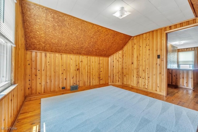 4465 W 156th St, Cleveland, OH 44135 - additional living space featuring wood-type flooring, wood walls, and vaulted ceiling