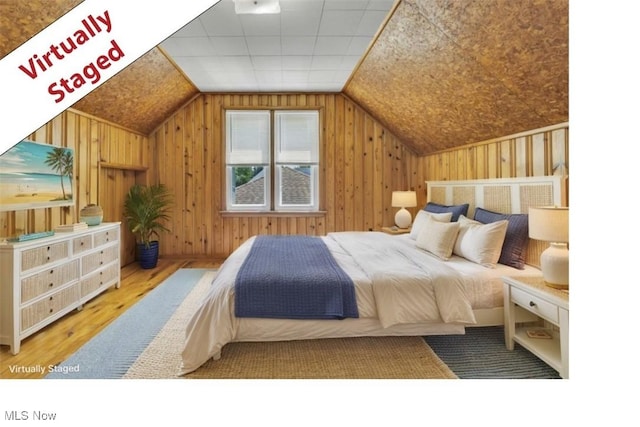 4465 W 156th St, Cleveland, OH 44135 - bedroom with wood finished floors, lofted ceiling, and wood walls