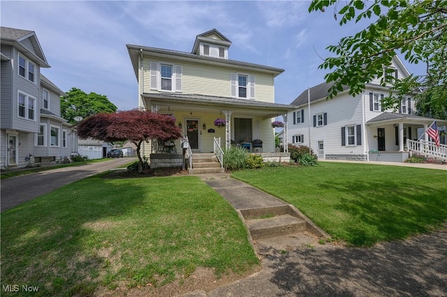 815 N Walnut St, Dover, OH 44622 - american foursquare style home featuring covered porch and a front lawn