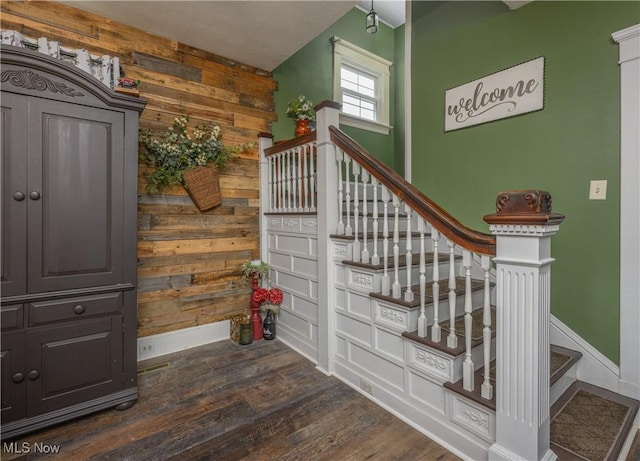 815 N Walnut St, Dover, OH 44622 - stairway featuring wood finished floors and wooden walls