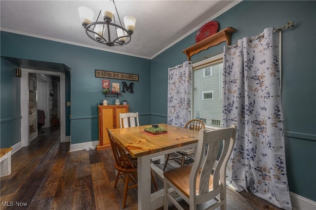 815 N Walnut St, Dover, OH 44622 - dining room with a chandelier, wood finished floors, and crown molding