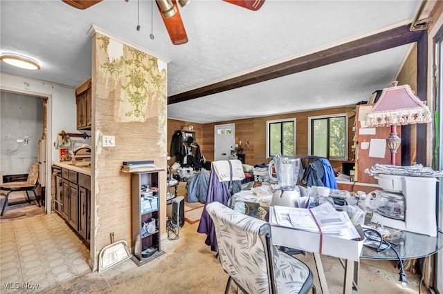 552 Turney Rd Unit A, Bedford, OH 44146 - dining space with a ceiling fan, wood walls, and beam ceiling