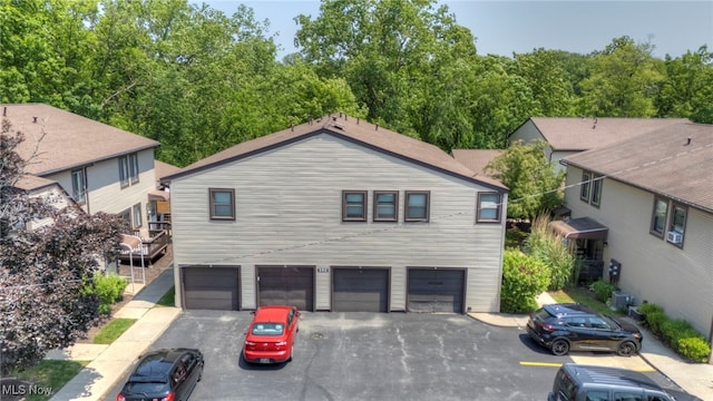 552 Turney Rd Unit A, Bedford, OH 44146 - view of front of property with driveway and an attached garage