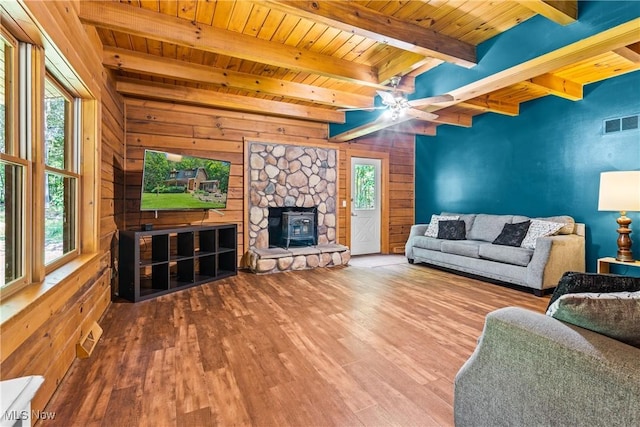 15961 Terramont St NE, Minerva, OH 44657 - living area with a wooden ceiling with exposed beams, wood finished floors, wood walls, and a ceiling fan