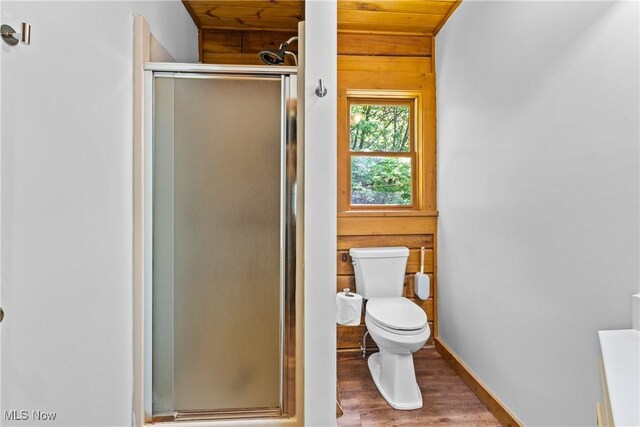 15961 Terramont St NE, Minerva, OH 44657 - bathroom featuring wood finished floors, a stall shower, wood walls, and wooden ceiling