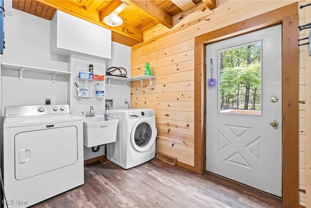 15961 Terramont St NE, Minerva, OH 44657 - laundry room with wood ceiling, separate washer and dryer, wood finished floors, wood walls, and a barn door