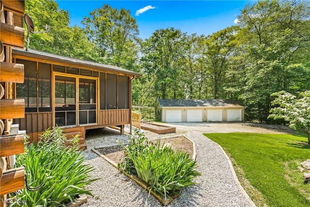 15961 Terramont St NE, Minerva, OH 44657 - view of green lawn with a sunroom, a detached garage, and an outdoor structure