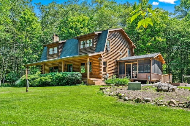 15961 Terramont St NE, Minerva, OH 44657 - cabin with a sunroom, a chimney, a front lawn, and log siding