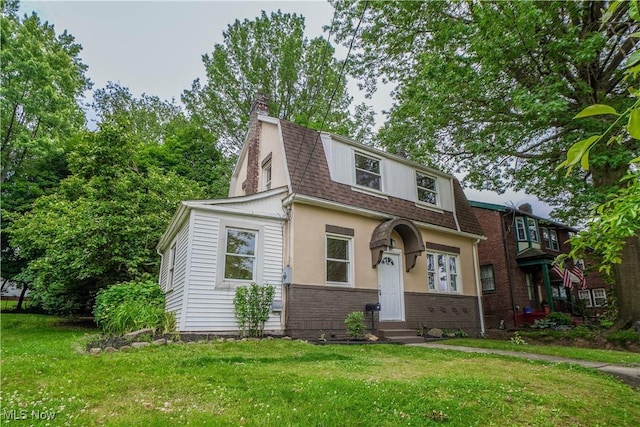 1967 Tonawanda Ave, Akron, OH 44305 - colonial inspired home with a shingled roof, a chimney, a front yard, brick siding, and entry steps
