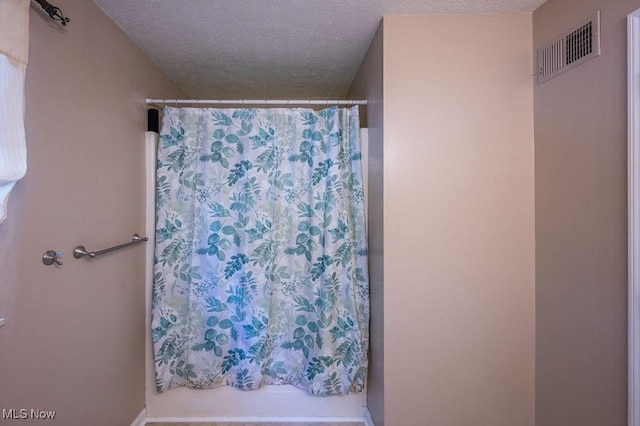 106 Wedgewood Dr, Parkersburg, WV 26104 - bathroom with a textured ceiling and a shower with shower curtain