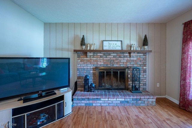 106 Wedgewood Dr, Parkersburg, WV 26104 - living area with wood finished floors, a fireplace, and a textured ceiling