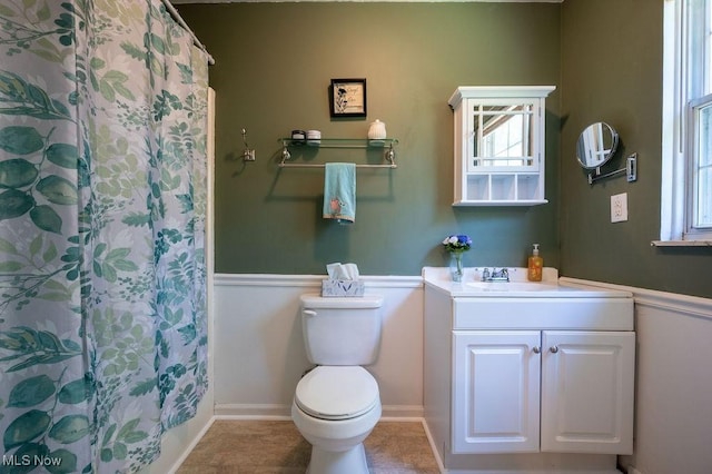 106 Wedgewood Dr, Parkersburg, WV 26104 - full bathroom with vanity, a wainscoted wall, a shower with shower curtain, and tile patterned floors