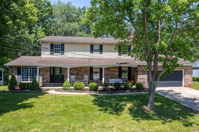 106 Wedgewood Dr, Parkersburg, WV 26104 - view of front of house with driveway, a front lawn, and brick siding