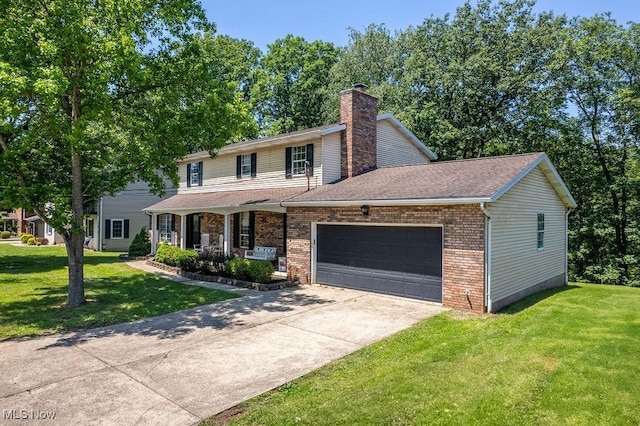 106 Wedgewood Dr, Parkersburg, WV 26104 - traditional home featuring covered porch, a garage, brick siding, and a front yard