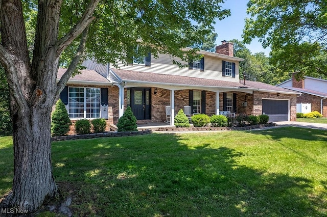 106 Wedgewood Dr, Parkersburg, WV 26104 - view of front of property with a garage, brick siding, a chimney, and a front lawn