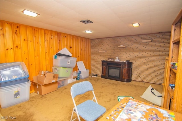 104 W Blvd, Mingo Junction, OH 43938 - carpeted living room with brick wall and wooden walls