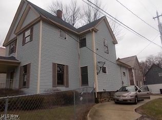 812 W W, Elyria, OH 44035 - view of home's exterior with a chimney