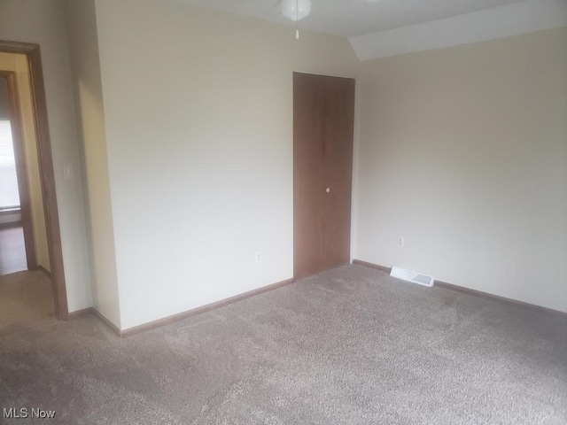812 W W, Elyria, OH 44035 - empty room with carpet, ceiling fan, and lofted ceiling