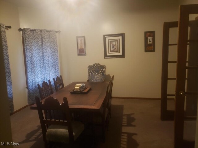 812 W W, Elyria, OH 44035 - carpeted dining space featuring baseboards