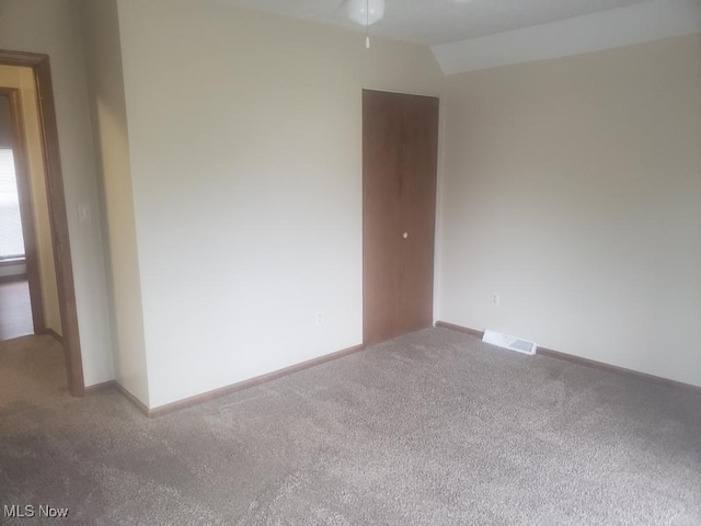 812 W W, Elyria, OH 44035 - carpeted empty room with a ceiling fan and vaulted ceiling