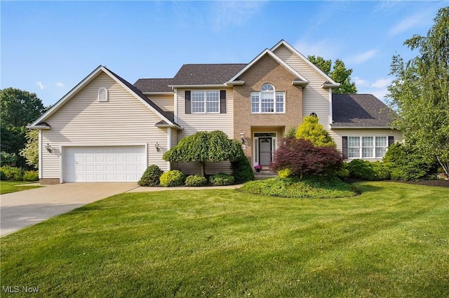 1288 Windward Ln, Kent, OH 44240 - view of front of house featuring concrete driveway, a front lawn, roof with shingles, and an attached garage